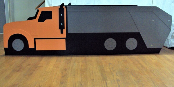 full garbage truck bed side view