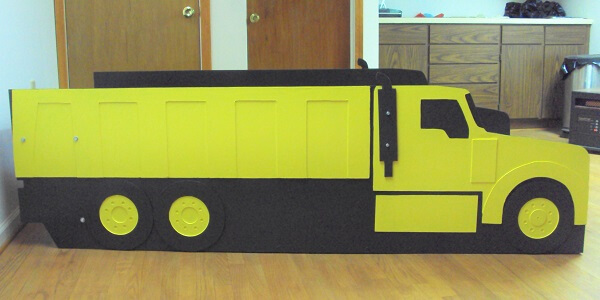 yellow dump truck bed frame side