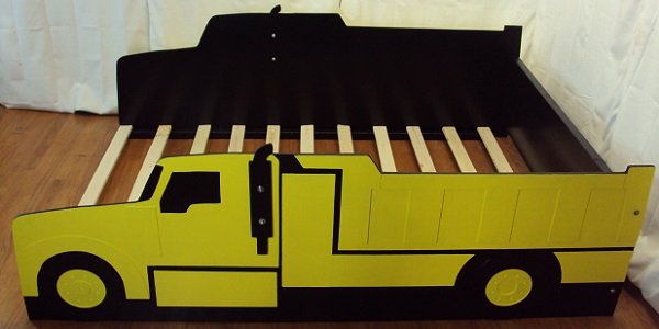yellow dump truck bed above side