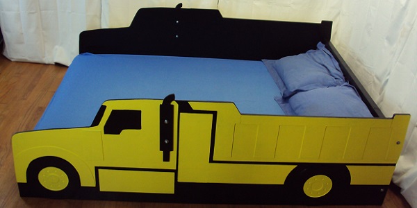 yellow dump truck bed with mattress
