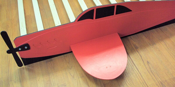 Red propeller plane close-up view