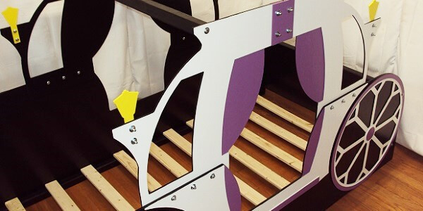Purple and white carriage bed