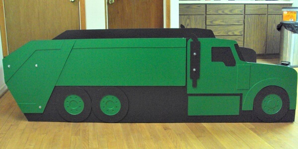green trash truck side view