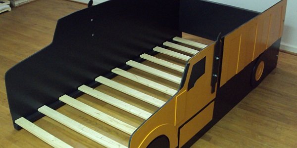 twin dump truck front three-quarter view